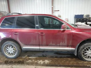 2004 Volkswagen Touareg z VIN WVGCM67LX4D038012, wystawiony jako IAAI lot #41285460 z przebiegiem Nie podano mil oraz . Historia ofert i sprzedaży dostępna na DreamBid. Obrazek 13.