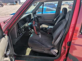 1996 Jeep Cherokee Sport with VIN 1J4FJ68S6TL171056, listed as a Copart auction lot 52099555 with 250,089 mi miles and Salvage Title. Bid and sale history available at carsss.com. Image 7.