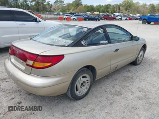 1997 Saturn SC z VIN 1G8ZE1285VZ125476, wystawiony jako IAAI lot #41832482 z przebiegiem 186 269 mil mil oraz . Historia ofert i sprzedaży dostępna na DreamBid. Obrazek 4.