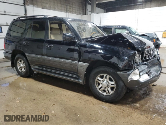 2002 Lexus LX 470 z VIN JTJHT00W023515545, wystawiony jako Copart lot #79218054 z przebiegiem 310 334 mil mil oraz Szkoda całkowita • Salvage title. Historia ofert i sprzedaży dostępna na DreamBid. Obrazek 4.