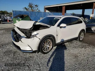 2017 Mazda CX-9 Grand Touring z VIN JM3TCADYXH0127867, wystawiony jako Copart lot #82352204 z przebiegiem 129 349 mil mil oraz Szkoda całkowita • Salvage title. Historia ofert i sprzedaży dostępna na DreamBid. Obrazek 1.