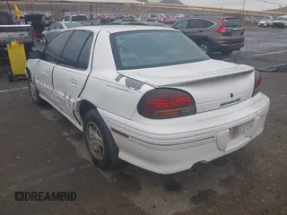 1998 Pontiac Grand Am SE2 with VIN 1G2NE52T7WM513702, listed as a IAAI auction lot 41503141 with 302,315 mi miles. Bid and sale history available at carsss.com. Image 3.