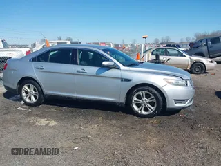 2013 Ford Taurus SEL with VIN 1FAHP2E8XDG164903, listed as a IAAI auction lot 41580690 with 163,128 mi miles and . Bid and sale history available at carsss.com. Image 13.