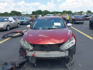 2016 Nissan Altima S z VIN 1N4AL3AP4GN353532, wystawiony jako IAAI lot #42325237 z przebiegiem 165 624 mil mil oraz . Historia ofert i sprzedaży dostępna na DreamBid. Obrazek 13.