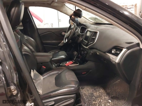 2017 Jeep Cherokee Trailhawk with VIN 1C4PJMBS8HW648454, listed as a IAAI auction lot 41094103 with 125,941 mi miles. Bid and sale history available at carsss.com. Image 5.