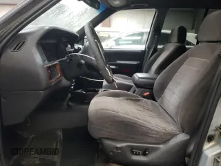 1998 Jeep Grand Cherokee Laredo with VIN 1J4GZ48S3WC269693, listed as a Copart auction lot 85026074 with 308,791 mi miles and Salvage Title. Bid and sale history available at carsss.com. Image 7.