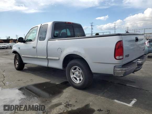 1998 Ford F-150 XL with VIN 1FTRX17L3WKB36791, listed as a Copart auction lot 42141915 with 201,067 mi miles and Salvage title. Bid and sale history available at DreamBid. Image 2.
