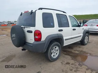 2002 Jeep Liberty Sport with VIN 1J4GL48K92W268896, listed as a IAAI auction lot 41788687 with 102,706 mi miles. Bid and sale history available at carsss.com. Image 4.