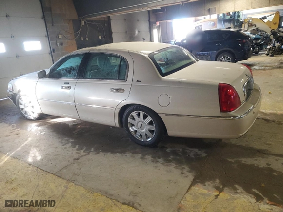 2003 Lincoln Town Car Cartier with VIN 1LNHM83W53Y695048, listed as a Copart auction lot 88715115 with 136,588 mi miles and Salvage Title. Bid and sale history available at carsss.com. Image 2.