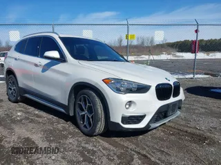 2019 BMW X1 xDrive28i with VIN WBXHT3C58K5N05523, listed as a IAAI auction lot 41752675 with 63,861 mi miles. Bid and sale history available at carsss.com. Image 1.