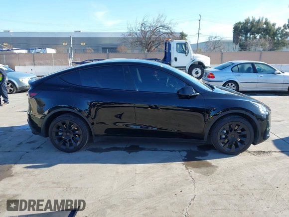 2024 Tesla Model Y Long Range with VIN 7SAYGDEEXRF983040, listed as a IAAI auction lot 41555332 with 79,506 mi miles and . Bid and sale history available at DreamBid. Image 13.