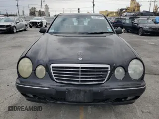 2002 Mercedes-Benz E-Class with VIN WDBJF65J42B486633, listed as a Copart auction lot 76979054 with 151,429 mi miles and Salvage Title. Bid and sale history available at carsss.com. Image 5.