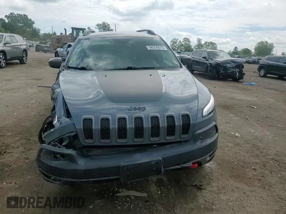 2015 Jeep Cherokee Trailhawk with VIN 1C4PJMBB1FW630715, listed as a Copart auction lot 58559675 with 58,302 mi miles and Salvage title. Bid and sale history available at DreamBid. Image 14.