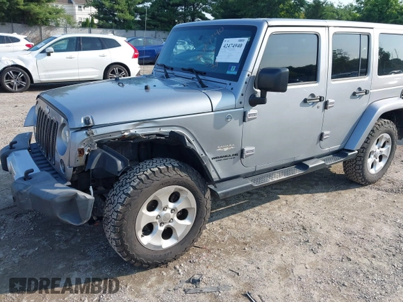 2015 Jeep Wrangler Unlimited Sahara with VIN 1C4BJWEG9FL570780, listed as a IAAI auction lot 42474940 with 116,226 mi miles and . Bid and sale history available at DreamBid. Image 6.