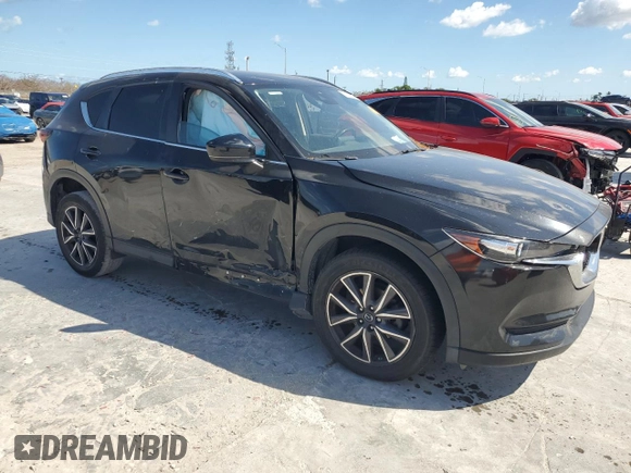 2018 Mazda CX-5 Touring with VIN JM3KFACM0J1408075, listed as a Copart auction lot 50866735 with Not Provided miles and Salvage Title. Bid and sale history available at carsss.com. Image 4.