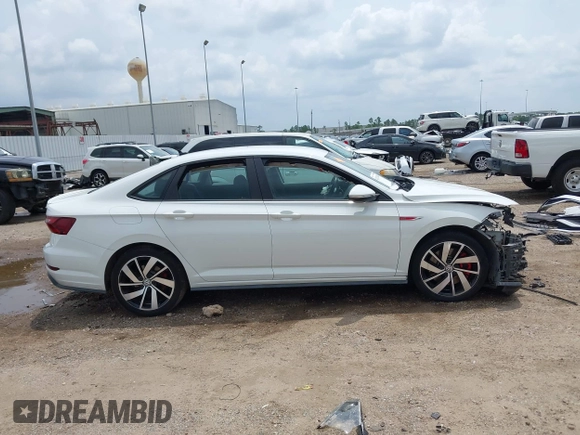 2021 Volkswagen Jetta S z VIN 3VW6T7BU2MM061165, wystawiony jako IAAI lot #42423828 z przebiegiem 41 603 mil mil oraz . Historia ofert i sprzedaży dostępna na DreamBid. Obrazek 13.