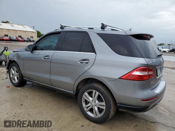2012 Mercedes-Benz M 350 with VIN 4JGDA5HB2CA027986, listed as a Copart auction lot 71714874 with 165,916 mi miles and Salvage title. Bid and sale history available at DreamBid. Image 2.