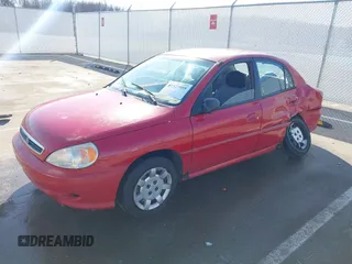 2002 Kia Rio with VIN KNADC123526160314, listed as a IAAI auction lot 41527989 with 124,252 mi miles. Bid and sale history available at carsss.com. Image 2.