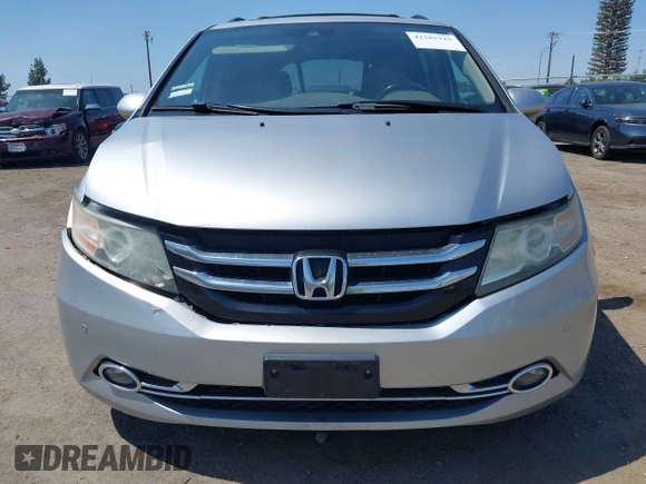 2014 Honda Odyssey Touring with VIN 5FNRL5H91EB068427, listed as a IAAI auction lot 42163315 with 184,134 mi miles and . Bid and sale history available at DreamBid. Image 13.
