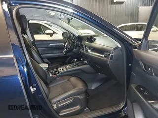 2020 Mazda CX-5 Touring with VIN JM3KFBCM5L0751284, listed as a IAAI auction lot 42157556 with 50,011 mi miles and . Bid and sale history available at DreamBid. Image 5.
