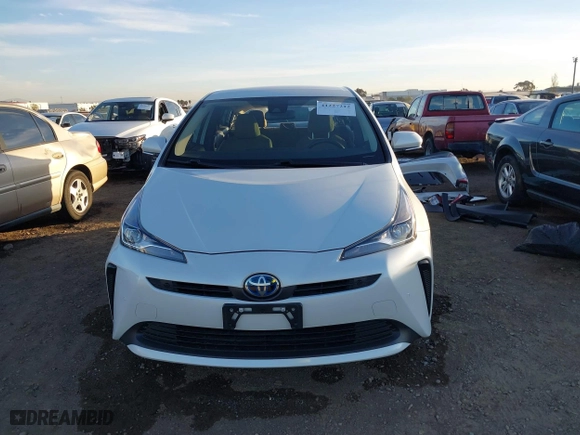 2021 Toyota Prius L Eco with VIN JTDKAMFU8M3132998, listed as a IAAI auction lot 41227212 with 64,681 mi miles. Bid and sale history available at carsss.com. Image 13.