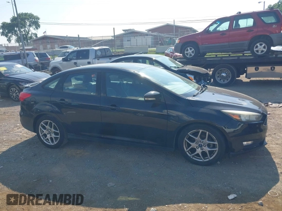2015 Ford Focus SE z VIN 1FADP3F25FL284097, wystawiony jako IAAI lot #42553323 z przebiegiem 139 647 mil mil oraz . Historia ofert i sprzedaży dostępna na DreamBid. Obrazek 13.