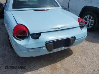 2003 Ford Thunderbird Deluxe z VIN 1FAHP60A53Y101461, wystawiony jako IAAI lot #42519933 z przebiegiem 64 820 mil mil oraz . Historia ofert i sprzedaży dostępna na DreamBid. Obrazek 6.