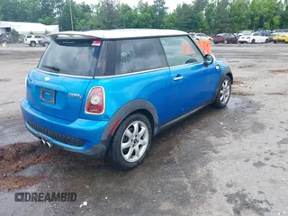 2010 MINI Hardtop S with VIN WMWMF7C55ATW88946, listed as a IAAI auction lot 42443200 with 104,953 mi miles and . Bid and sale history available at DreamBid. Image 4.