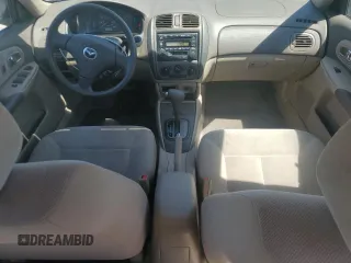 2002 Mazda Protege DX with VIN JM1BJ225121567924, listed as a Copart auction lot 54847545 with 93,653 mi miles and Salvage Title. Bid and sale history available at DreamBid. Image 8.