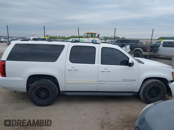 2013 Chevrolet Suburban LT with VIN 1GNSCJE05DR147101, listed as a IAAI auction lot 42336950 with 147,429 mi miles and . Bid and sale history available at DreamBid. Image 14.