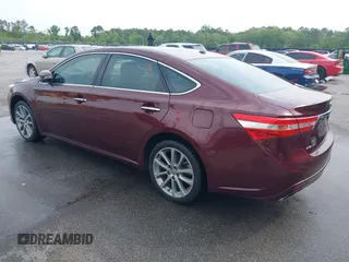 2014 Toyota Avalon Limited with VIN 4T1BK1EB3EU113035, listed as a IAAI auction lot 42040239 with 118,609 mi miles. Bid and sale history available at carsss.com. Image 3.