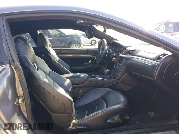 2013 Maserati GranTurismo Sport with VIN ZAM45VLA7D0074506, listed as a IAAI auction lot 41455462 with 34,292 mi miles and . Bid and sale history available at DreamBid. Image 5.