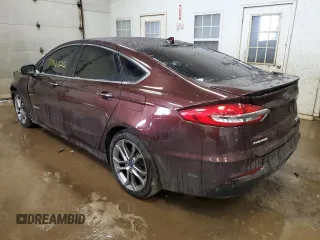 2019 Ford Fusion Hybrid Titanium with VIN 3FA6P0RU2KR211799, listed as a Copart auction lot 70843212 with 54,157 mi miles. Bid and sale history available at carsss.com. Image 2.