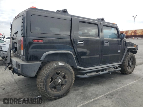 2003 Hummer H2 with VIN 5GRGN23UX3H101416, listed as a Copart auction lot 84423354 with 113,699 mi miles and Clean Title. Bid and sale history available at carsss.com. Image 3.
