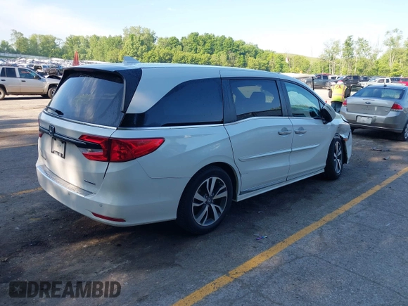 2022 Honda Odyssey Touring with VIN 5FNRL6H88NB026592, listed as a IAAI auction lot 42367048 with 57,066 mi miles and . Bid and sale history available at DreamBid. Image 4.