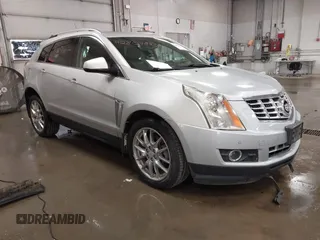 2014 Cadillac SRX Performance Collection with VIN 3GYFNFE34ES657122, listed as a IAAI auction lot 42804883 with 92,534 mi miles and . Bid and sale history available at DreamBid. Image 1.