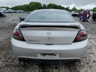 2008 Hyundai Tiburon GS z VIN KMHHM66D68U288062, wystawiony jako Copart lot #58261695 z przebiegiem 130 310 mil mil oraz Tytuł czysty. Historia ofert i sprzedaży dostępna na DreamBid. Obrazek 6.