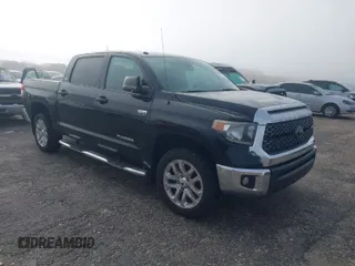 2018 Toyota Tundra SR5 z VIN 5TFDW5F14JX777223, wystawiony jako IAAI lot #41922404 z przebiegiem 152 893 mil mil oraz . Historia ofert i sprzedaży dostępna na DreamBid. Obrazek 1.