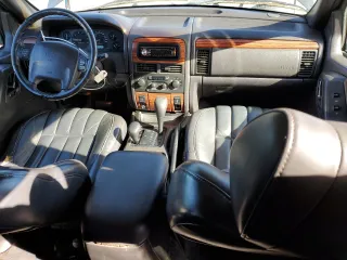 1999 Jeep Grand Cherokee Limited with VIN 1J4GW68N9XC743436, listed as a Copart auction lot 86803524 with 129,204 mi miles and Clean Title. Bid and sale history available at carsss.com. Image 8.