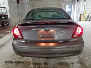 2002 Ford Taurus SES Standard z VIN 1FAFP55U72A161401, wystawiony jako Copart lot #55893125 z przebiegiem 128 258 mil mil oraz Czysty tytuł • Clean title. Historia ofert i sprzedaży dostępna na DreamBid. Obrazek 6.