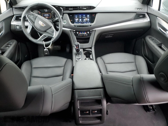 2023 Cadillac XT5 FWD Luxury z VIN 1GYKNAR47PZ144988, wystawiony jako Copart lot #50830365 z przebiegiem 17 687 mil mil oraz Szkoda całkowita • Salvage title. Historia ofert i sprzedaży dostępna na DreamBid. Obrazek 8.