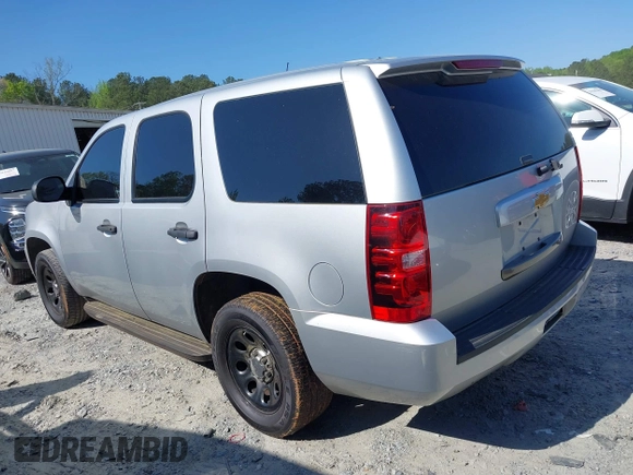 2013 Chevrolet Tahoe Commercial with VIN 1GNLC2E03DR124278, listed as a IAAI auction lot 39201429 with 182,584 mi miles and . Bid and sale history available at DreamBid. Image 3.