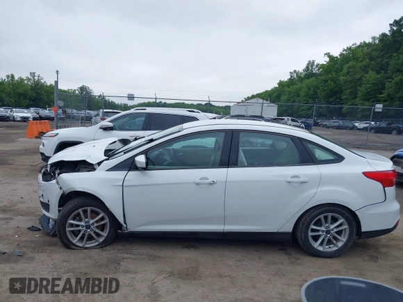 2018 Ford Focus SE z VIN 1FADP3F24JL247003, wystawiony jako IAAI lot #42531969 z przebiegiem 55 344 mil mil oraz . Historia ofert i sprzedaży dostępna na DreamBid. Obrazek 14.