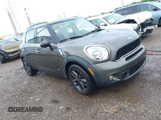 2011 MINI Countryman S z VIN WMWZC5C53BWM11022, wystawiony jako IAAI lot #42249403 z przebiegiem 173 718 mil mil oraz . Historia ofert i sprzedaży dostępna na DreamBid. Obrazek 1.