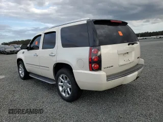 2012 GMC Yukon Denali with VIN 1GKS1EEF2CR293128, listed as a Copart auction lot 74567484 with 0 mi miles and Salvage Title. Bid and sale history available at carsss.com. Image 2.