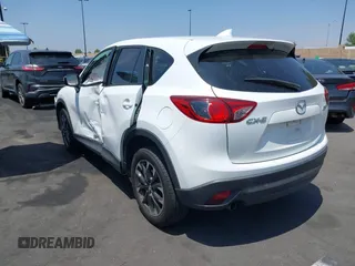 2016 Mazda CX-5 Grand Touring z VIN JM3KE2DY2G0824802, wystawiony jako IAAI lot #42170591 z przebiegiem 53 173 mil mil oraz . Historia ofert i sprzedaży dostępna na DreamBid. Obrazek 3.