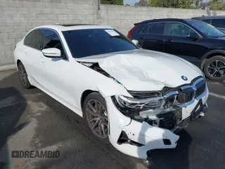 2021 BMW 3 Series 330e with VIN 3MW5P7J00M8C21180, listed as a IAAI auction lot 41451850 with 70,459 mi miles. Bid and sale history available at carsss.com. Image 1.