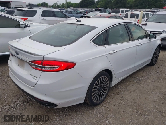 2017 Ford Fusion Titanium z VIN 3FA6P0K96HR124146, wystawiony jako IAAI lot #42428041 z przebiegiem 204 306 mil mil oraz . Historia ofert i sprzedaży dostępna na DreamBid. Obrazek 4.