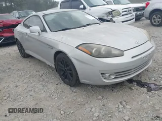 2008 Hyundai Tiburon GS z VIN KMHHM66D68U264666, wystawiony jako IAAI lot #41970123 z przebiegiem 186 448 mil mil oraz . Historia ofert i sprzedaży dostępna na DreamBid. Obrazek 1.