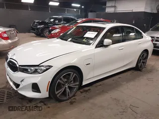 2023 BMW 3 Series 330e xDrive with VIN 3MW39FS05P8D20575, listed as a IAAI auction lot 42076033 with 10,875 mi miles. Bid and sale history available at carsss.com. Image 2.